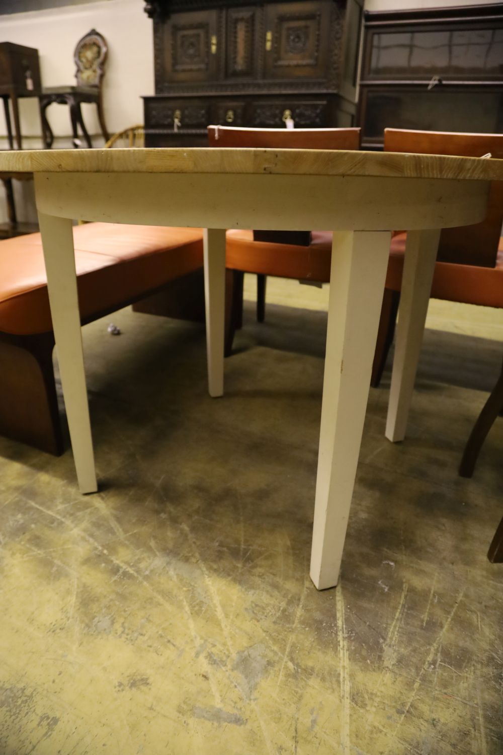 A contemporary circular oak dining table, 110cm diameter